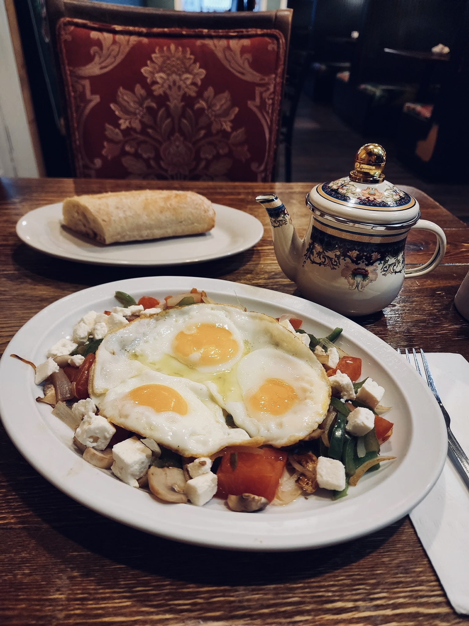 Sunny-side eggs with feta, veggies & fresh bread